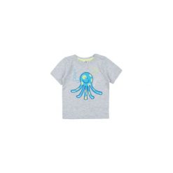 T-shirt. Kaftaniki i bluzki niemowlęce TXM, bez wzorów. Za 9,99 zł.