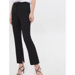 Spodnie slim fit Eco Aware - Czarny. Czarne spodnie damskie Mohito, bez wzorów. Za 139,99 zł.