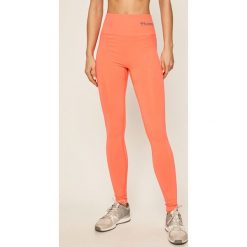 Hummel - Legginsy. Pomarańczowe spodnie damskie Hummel, s, bez wzorów, z elastanu. W wyprzedaży za 79,90 zł.