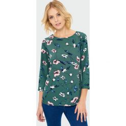 Bluzka w kwiaty. Szare bluzki damskie Greenpoint, w kwiaty, z poliesteru, bez kołnierzyka, bez rękawów. Za 79,99 zł.