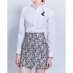 Spódnica w kolorze granatowo-kremowym. Niebieskie spódniczki damskie Cacharel, w paski, z bawełny, klasyczne, z standardowym stanem, mini. W wyprzedaży za 289,95 zł.