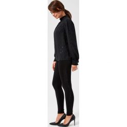 Legginsy z błyszczącymi aplikacjami. Czarne legginsy damskie wyszczuplające Moodo, s, z elastanu. Za 79,99 zł.