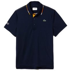Koszulka polo w kolorze granatowym. Niebieskie koszulki męskie Lacoste, s, z haftami, polo, bez rękawów. W wyprzedaży za 277,95 zł.