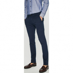 Guess Jeans - Spodnie. Szare rurki męskie Guess Jeans, z aplikacjami, z bawełny. Za 399,90 zł.