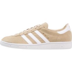 Adidas Originals MUNCHEN Tenisówki i Trampki raw gold/footwear white/gold metallic. Brązowe tenisówki damskie marki adidas Originals, ze skóry ekologicznej. Za 449,00 zł.