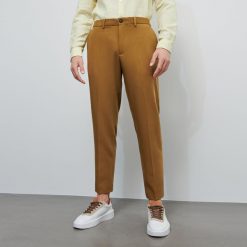 Eleganckie spodnie z elastycznym pasem - Beżowy. Brązowe spodnie męskie Reserved, m, bez wzorów, eleganckie. Za 129,99 zł.