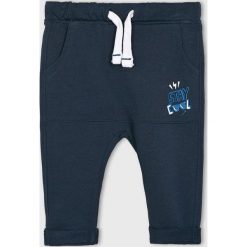 Blukids - Spodnie dziecięce 68-98 cm. Niebieskie spodnie chłopięce Blukids, bez wzorów, z bawełny, casualowe. W wyprzedaży za 29,90 zł.