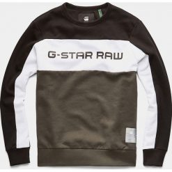 Bluza "Swando" w kolorze oliwkowo-czarnym. Brązowe bluzy męskie G-Star, m, z nadrukiem, z okrągłym kołnierzem, bez rękawów, bez kaptura. W wyprzedaży za 212,95 zł.
