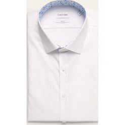 Calvin Klein - Koszula. Niebieskie koszule męskie Calvin Klein, bez wzorów, z bawełny, eleganckie, z klasycznym kołnierzykiem, z długim rękawem. Za 299,90 zł.