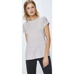 Reebok - Top. Fioletowe topy damskie marki Reebok, s, z elastanu, z okrągłym kołnierzem. W wyprzedaży za 89,90 zł.