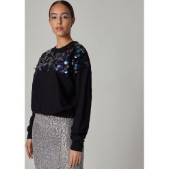Bluza z dużymi cekinami - Czarny. Czarne bluzy damskie Sinsay, s, bez wzorów, bez rękawów, bez kaptura. Za 69,99 zł.