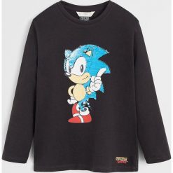 Mango Kids - Longsleeve dziecięcy Sonic 110-164 cm. Czarne t-shirty chłopięce Mango Kids, z aplikacjami, z bawełny, z długim rękawem. W wyprzedaży za 49,90 zł.