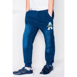 Chinosy chłopięce: SPODNIE DZIECIĘCE DRESOWE KP005 - JEANSOWE/ŻÓŁTE