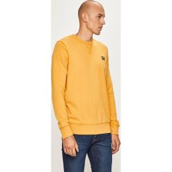 Wrangler - Bluza. Żółte bluzy męskie Wrangler, s, bez wzorów, z bawełny, z okrągłym kołnierzem, bez rękawów, bez kaptura. Za 199,90 zł.