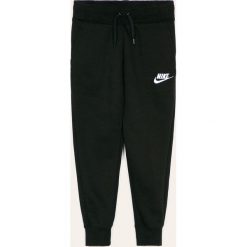 Nike Kids - Spodnie dziecięce 122-166 cm. Czarne spodnie dziewczęce Nike Kids, bez wzorów, z bawełny. Za 119,90 zł.