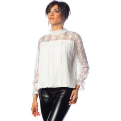 Bluzka "Tara" w kolorze białym. Białe bluzki damskie Saint Germain Paris, m, w koronkowe wzory, z koronki, ze stójką, bez rękawów. W wyprzedaży za 129,95 zł.