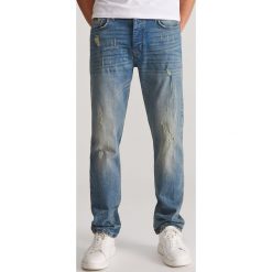 Jeansowe spodnie - Niebieski. Niebieskie spodnie męskie Reserved, m, bez wzorów, z jeansu. Za 149,99 zł.