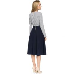 RACHELE Rozkloszowana spódnica z kontrafałami - granatowa. Niebieskie koszule damskie Stylove, na co dzień, s, bez wzorów, eleganckie, rozkloszowane. Za 109,90 zł.