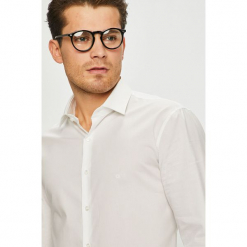 Calvin Klein - Koszula. Białe koszule męskie Calvin Klein, bez wzorów, z elastanu, klasyczne, z klasycznym kołnierzykiem, z długim rękawem. Za 299,90 zł.