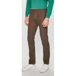 Tom Tailor Denim - Spodnie. Pomarańczowe spodnie męskie TOM TAILOR DENIM, bez wzorów, z elastanu. W wyprzedaży za 89,90 zł.