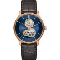 ZEGAREK RADO R22 895 21 5. Różowe zegarki męskie RADO, złote. Za 6800,00 zł.