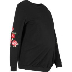 Bluza ciążowa z kwiatowym zdobieniem bonprix czarny. Czarne bluzy damskie bonprix, z aplikacjami, z dresówki, bez rękawów, bez kaptura. Za 99,99 zł.
