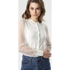 Kremowy Sweter Tanisha. Brązowe swetry damskie Born2be, s, bez wzorów, bez rękawów, długie, bez kaptura. Za 99,99 zł.