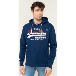 Bluza Superdry Vl Stripe M2000133A. Niebieskie bluzy męskie Superdry, m, bez wzorów, z bawełny, bez kołnierzyka, bez rękawów, bez kaptura. W wyprzedaży za 269,00 zł.