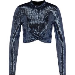 Bluzka Marciano Guess 94G627 6877Z. Niebieskie bluzki damskie MARCIANO GUESS, m, z aplikacjami, z elastanu, bez kołnierzyka, bez rękawów. W wyprzedaży za 269,00 zł.