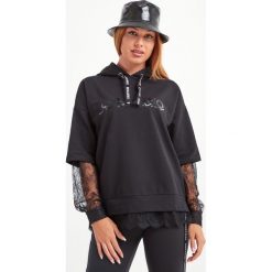 BLUZA ERMANNO SCERVINO. Czarne bluzy damskie Ermanno Scervino, z nadrukiem, z koronki, bez rękawów, z kapturem. Za 1459,00 zł.