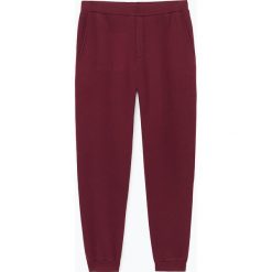 Spodnie dresowe "Kinibay" w kolorze ciemnoczerwonym. Czerwone spodnie męskie American Vintage, xl, bez wzorów, z bawełny. W wyprzedaży za 129,95 zł.