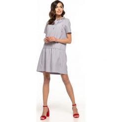 Sukienka z falbaną u dołu szara. Szare sukienki damskie e-margeritka.pl, xl, bez wzorów, z poliesteru, z długim rękawem, długie, bez kaptura. Za 138,99 zł.