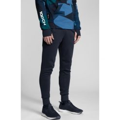 Spodnie dresowe męskie Kamil Stoch Collection SPMD501 - granat. Szare spodnie dresowe męskie marki 4f, m, z dzianiny. W wyprzedaży za 129,99 zł.