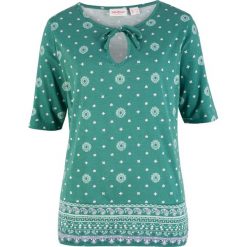 Tunika shirtowa z nadrukiem, krótki rękaw bonprix dymny szmaragdowy wzorzysty. Niebieskie tuniki damskie bonprix, z nadrukiem. Za 22,99 zł.