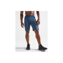 Spodenki fitness kardio FST120 męskie. Niebieskie spodenki sportowe męskie DOMYOS, s, bez wzorów, z elastanu, na fitness i siłownię. Za 99,99 zł.