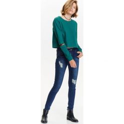 Bluza nierozpinana damska z ozdobnymi rozcięciami na łokciach. Zielone bluzy damskie TROLL, na zimę, s, bez wzorów, z dzianiny, z krótkim rękawem, krótkie, bez kaptura. W wyprzedaży za 29,99 zł.