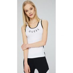 Guess Jeans - Top. Szare topy sportowe damskie marki Guess Jeans, s, z nadrukiem, z elastanu, z okrągłym kołnierzem. W wyprzedaży za 119,90 zł.