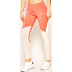 Legginsy NIKE Sportswear CJ3693. Pomarańczowe legginsy damskie Nike, xs, bez wzorów. W wyprzedaży za 129,00 zł.