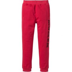 Spodnie sportowe z nadrukiem bonprix czerwony. Czerwone spodnie męskie bonprix, m, z nadrukiem, sportowe. Za 44,99 zł.