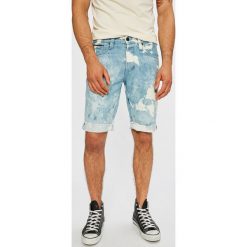 Tommy Jeans - Szorty. Niebieskie spodenki i szorty męskie marki Tommy Jeans, z bawełny, casualowe. W wyprzedaży za 169,90 zł.