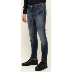 Jeansy Skinny Fit Tommy Jeans Simon DM0DM07343. Niebieskie jeansy męskie Tommy Jeans, m, bez wzorów. W wyprzedaży za 469,00 zł.