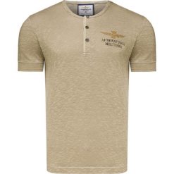 T-shirt AERONAUTICA MILITARE. Brązowe t-shirty męskie Aeronautica Militare, z nadrukiem, z bawełny, bez kołnierzyka. W wyprzedaży za 322,00 zł.