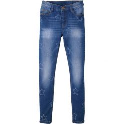 Dżinsy dziewczęce SKINNY w gwiazdy bonprix niebieski "stone”. Niebieskie spodnie dziewczęce bonprix, bez wzorów, z elastanu. Za 99,99 zł.