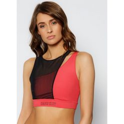 Biustonosz top Calvin Klein Performance Medium Support Sports Bra 00GWS0K167. Topy damskie Calvin Klein Performance, l, bez wzorów, z elastanu, bez kołnierzyka. W wyprzedaży za 219,00 zł.