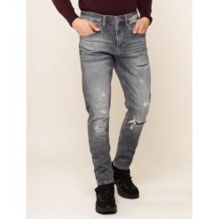 Jeansy Tapered Fit Tommy Jeans Tj 1988 DM0DM06427. Szare jeansy męskie Tommy Jeans, m, bez wzorów. W wyprzedaży za 329,00 zł.