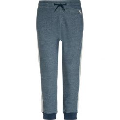 Abercrombie & Fitch SIDE STRIPE Spodnie treningowe navy. Niebieskie spodnie dresowe dziewczęce marki Abercrombie & Fitch, z bawełny. W wyprzedaży za 134,25 zł.