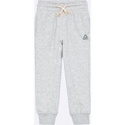 Reebok - Spodnie dziecięce 104-164 cm. Szare spodnie dziewczęce Reebok, bez wzorów, z elastanu, sportowe. W wyprzedaży za 69,90 zł.