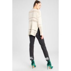 Free People BELONG TO YOU Sweter ivory. Białe bluzy damskie marki Free People, bez wzorów, z bawełny, bez rękawów, bez kaptura. W wyprzedaży za 377,30 zł.
