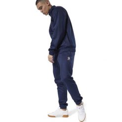 MĘSKIE SPODNIE DRESOWE REEBOK (L). Spodnie męskie Reebok, na jesień, s, bez wzorów, z dresówki, sportowe. W wyprzedaży za 209,99 zł.