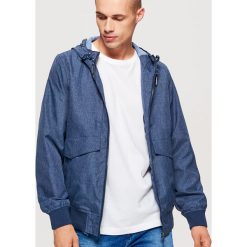 Sportowa kurtka z kapturem - Granatowy. Niebieskie kurtki sportowe damskie marki Cropp, s. Za 169,99 zł.
